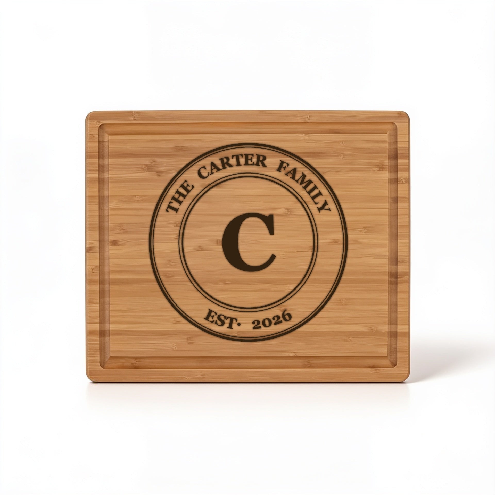 Circle monogram with family name, initial and est. year engraved on bamboo cutting board