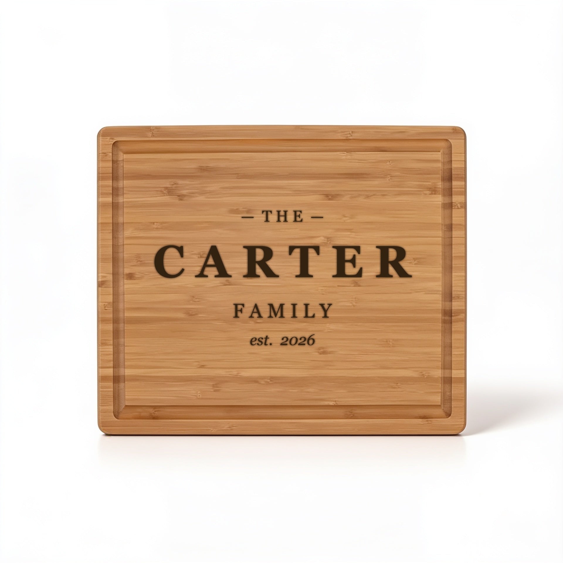 Family name and est. year block design engraved on bamboo cutting board